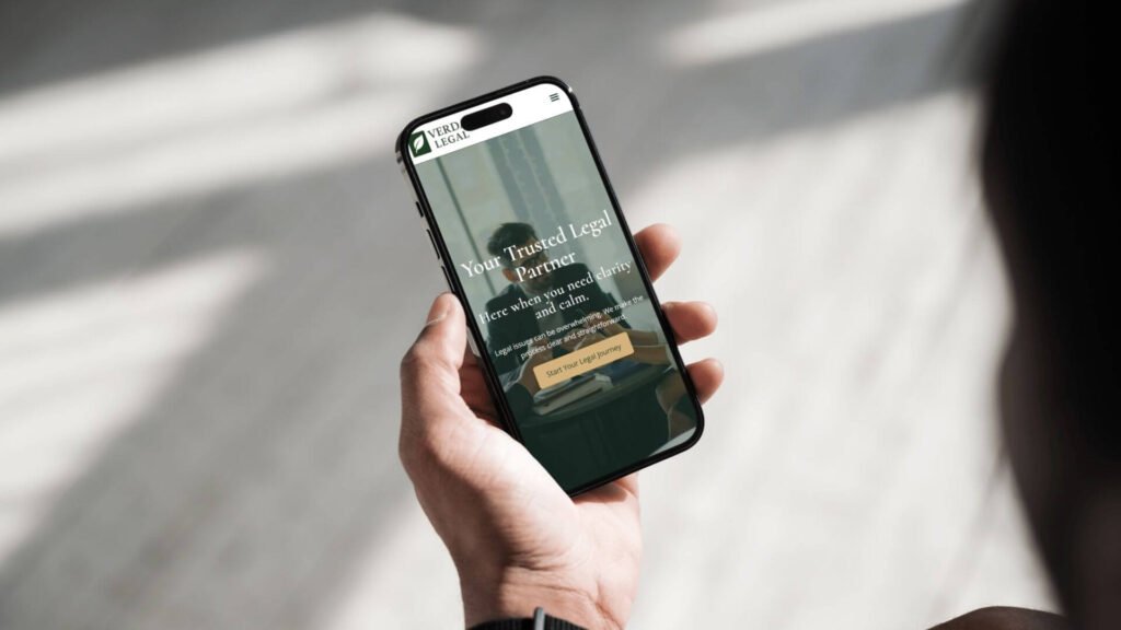 mobile responsive website design showing on a screen held in a hand website development